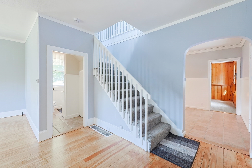 64 Smith Street North Attleboro, MA 02760 - Photo 29 of 42 a view of a hallway with entryway wooden floor and windows