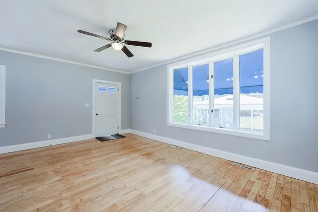 a kitchen with a refrigerator and a stove top oven