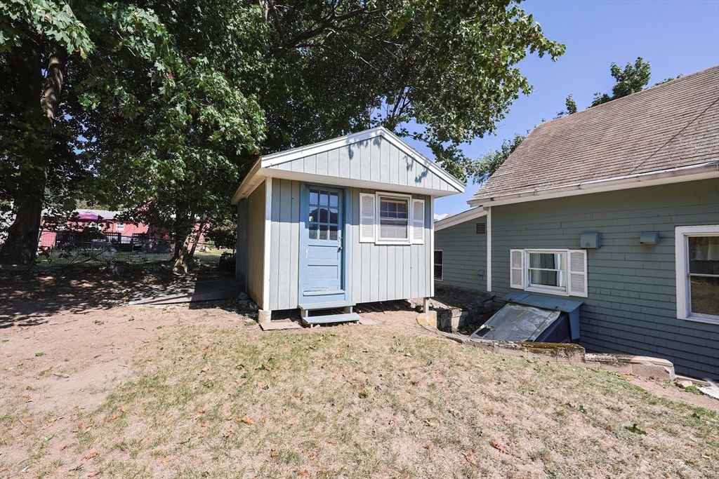 64 Smith Street North Attleboro, MA 02760 - Photo 37 of 42 a front view of a house with a yard covered in snow