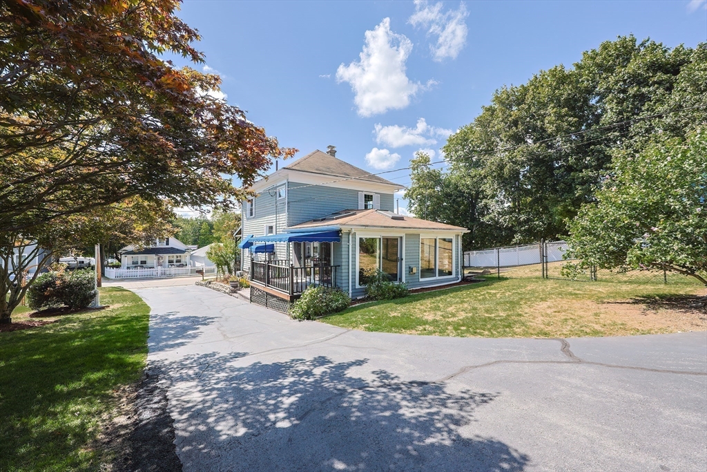 64 Smith Street North Attleboro, MA 02760 - Photo 41 of 42 a view of a house with a yard and large trees