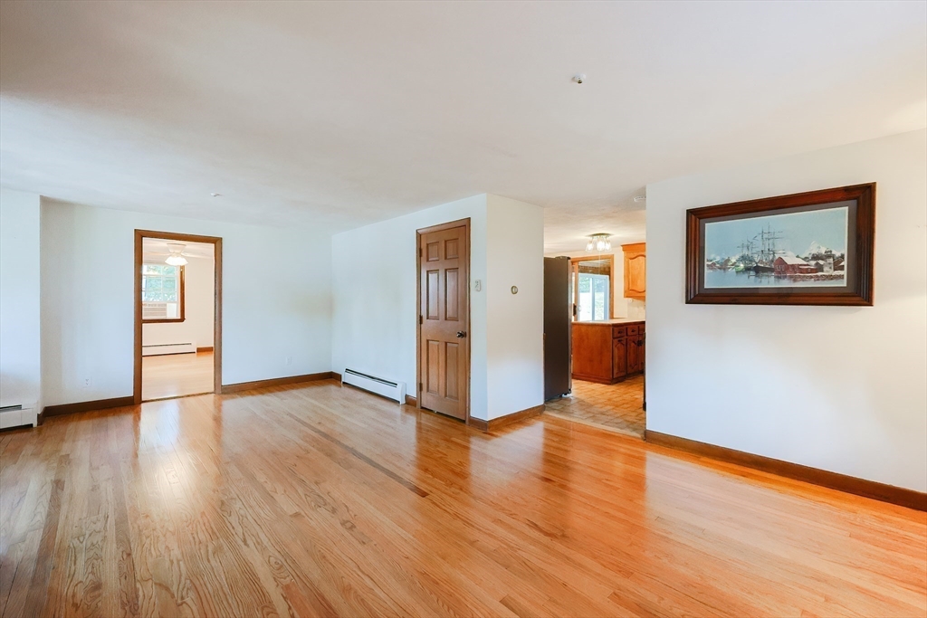 64 Smith Street North Attleboro, MA 02760 - Photo 5 of 42 a view of a big room with wooden floor and windows