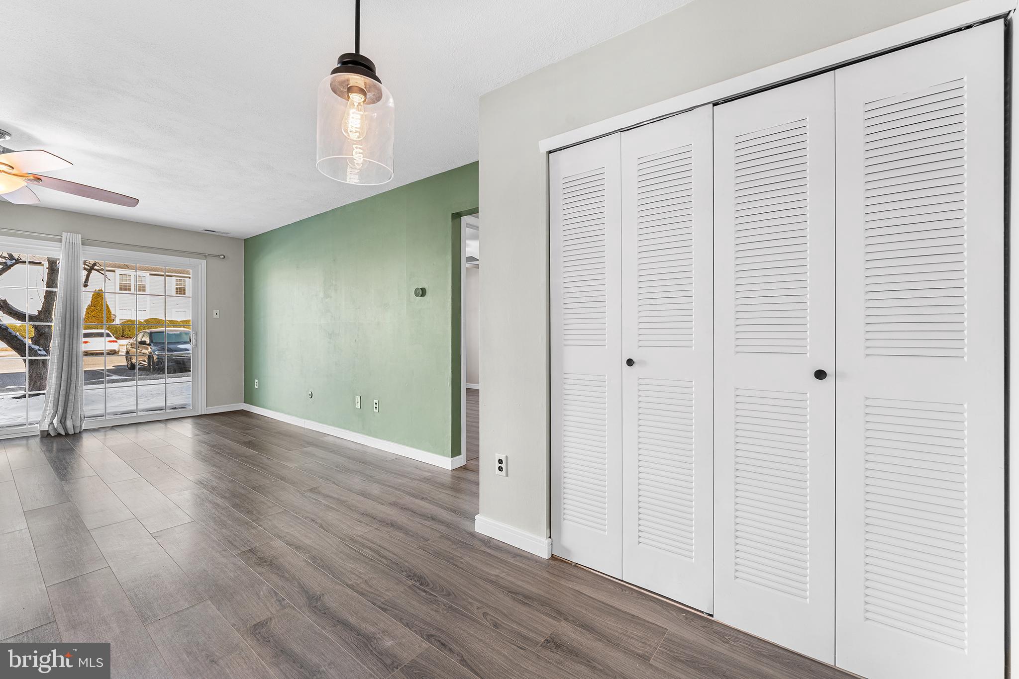 701 Sedgewick Court, Unit 701 Sewell, NJ 08080 - Photo 12 of 31 an empty room with wooden floor and windows