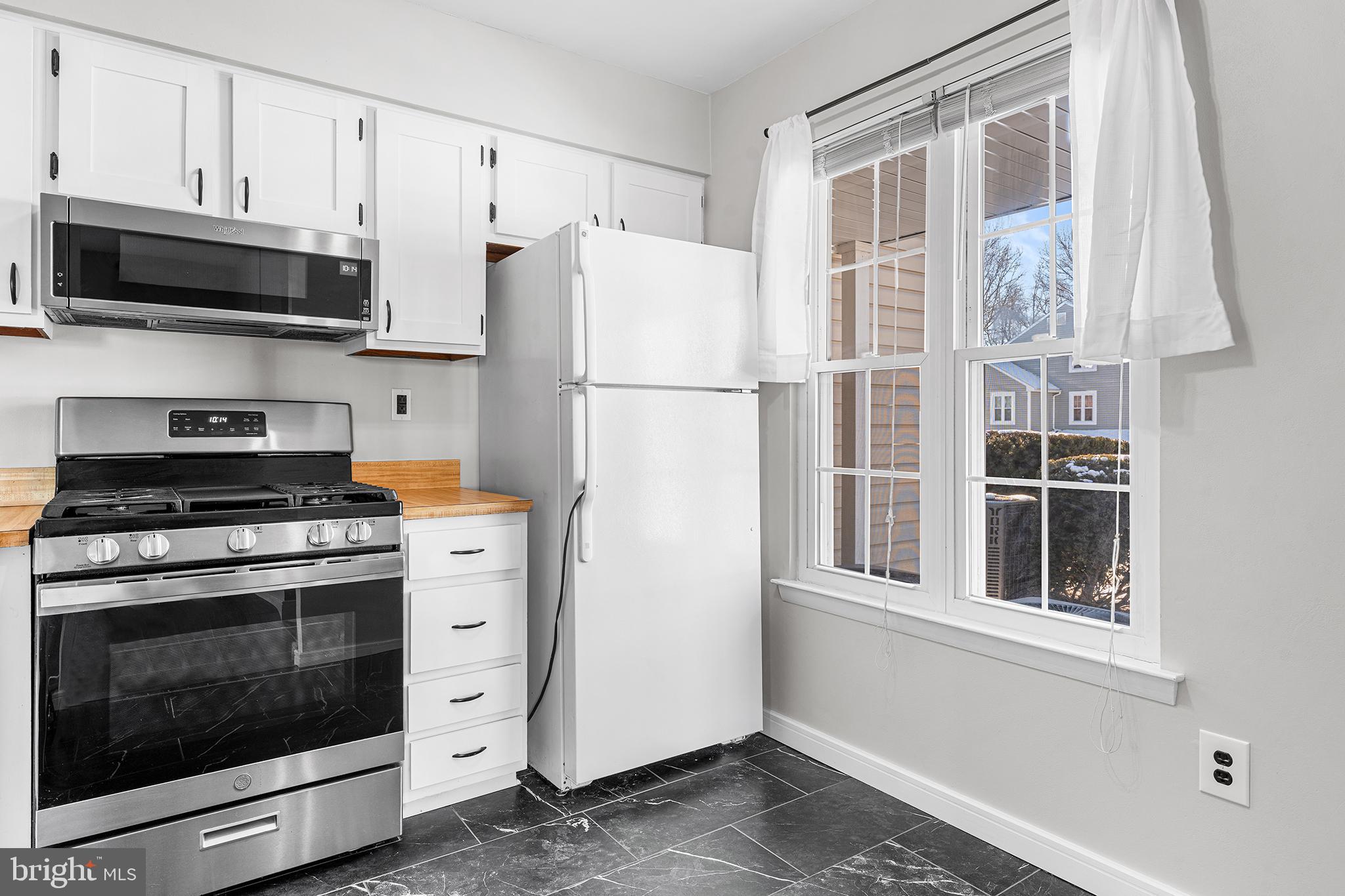701 Sedgewick Court, Unit 701 Sewell, NJ 08080 - Photo 14 of 31 a kitchen with stainless steel appliances white cabinets and a refrigerator