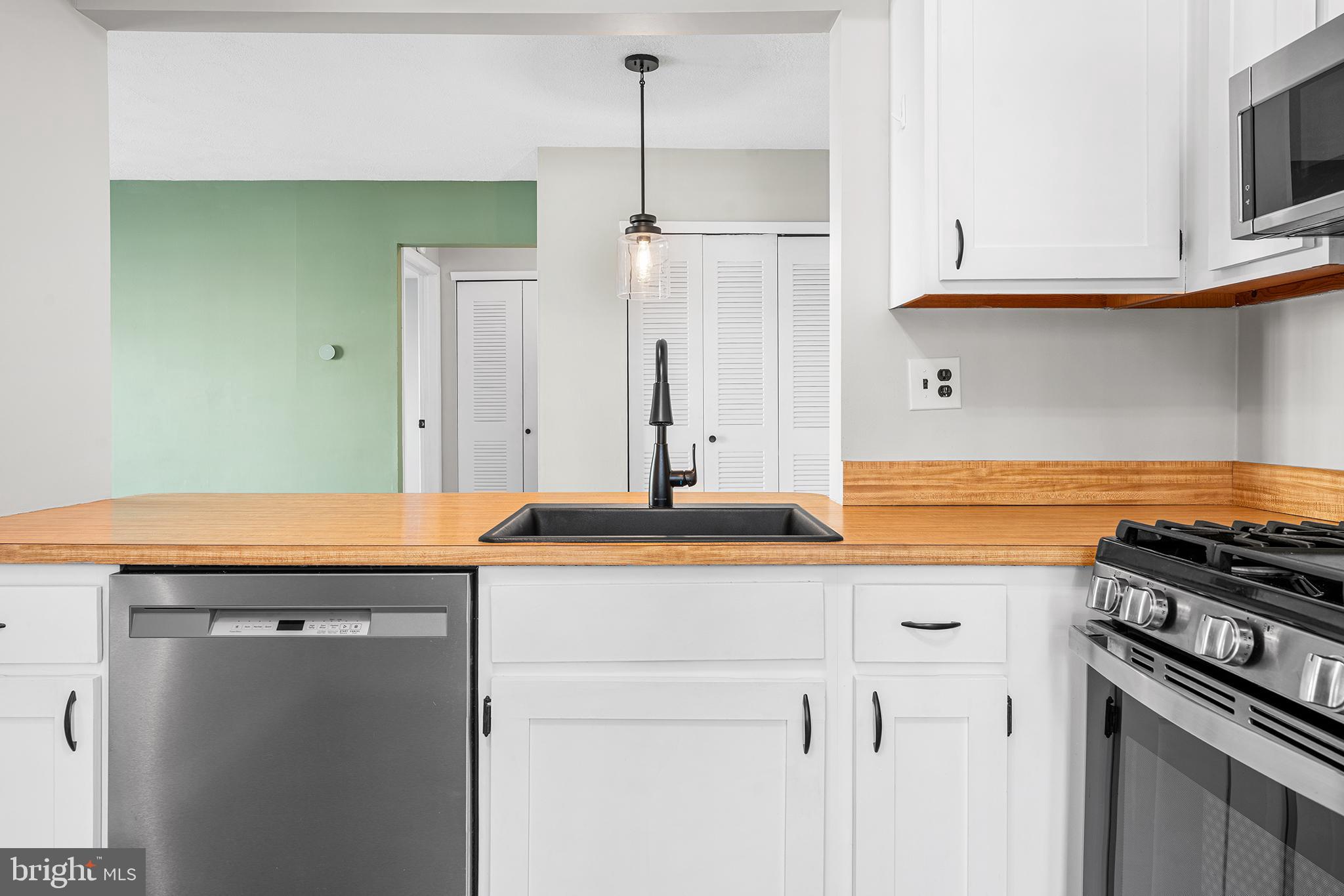 701 Sedgewick Court, Unit 701 Sewell, NJ 08080 - Photo 17 of 31 a kitchen with stainless steel appliances granite countertop a sink and a stove