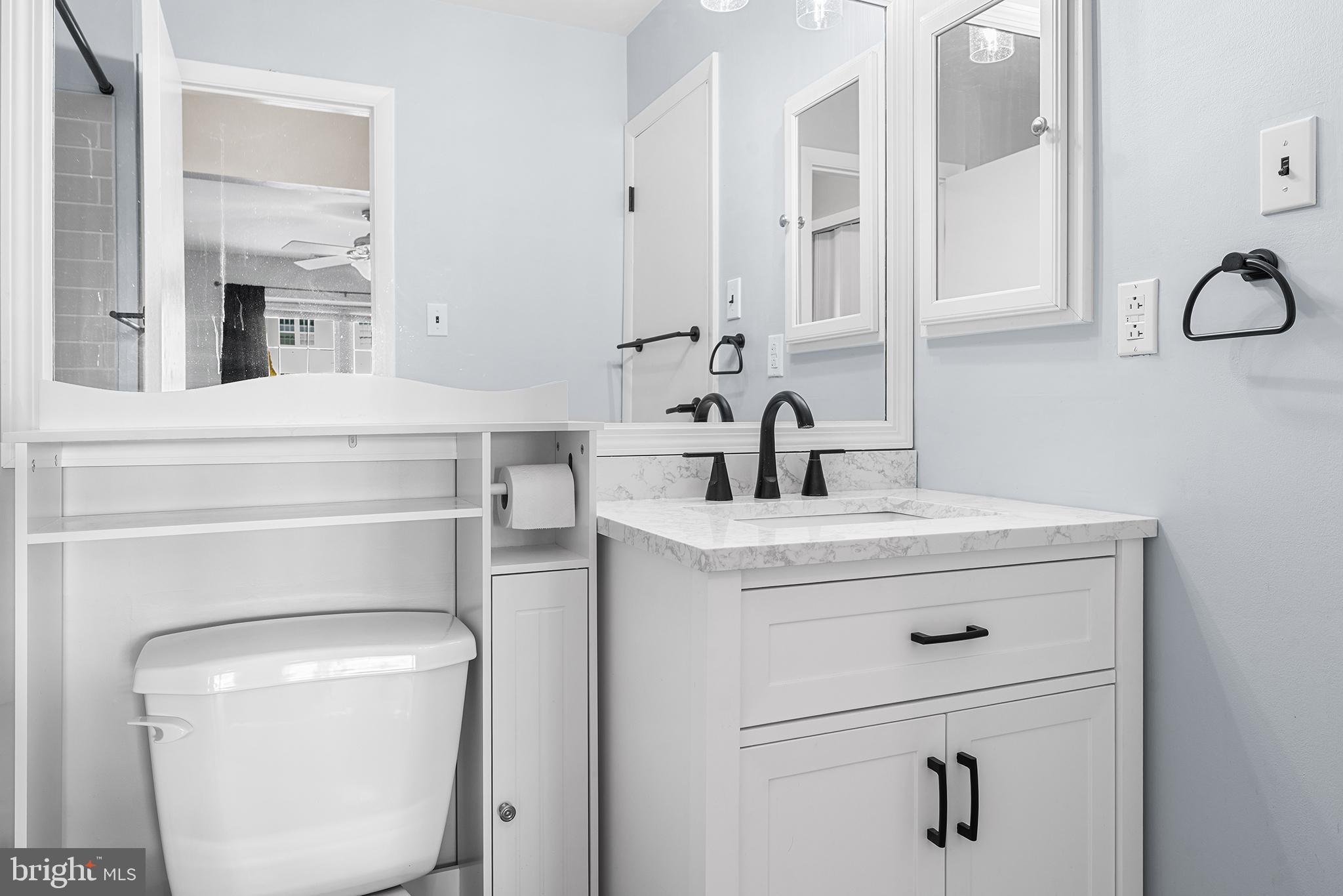 701 Sedgewick Court, Unit 701 Sewell, NJ 08080 - Photo 23 of 31 a bathroom with a toilet sink and mirror