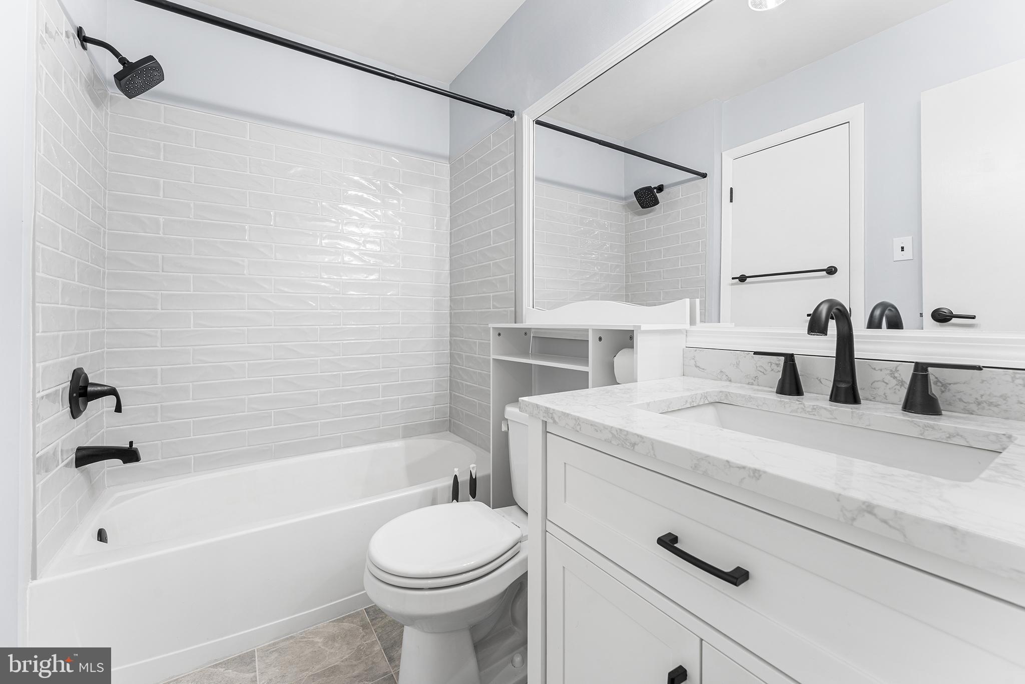 701 Sedgewick Court, Unit 701 Sewell, NJ 08080 - Photo 24 of 31 a bathroom with a sink a toilet and a bathtub