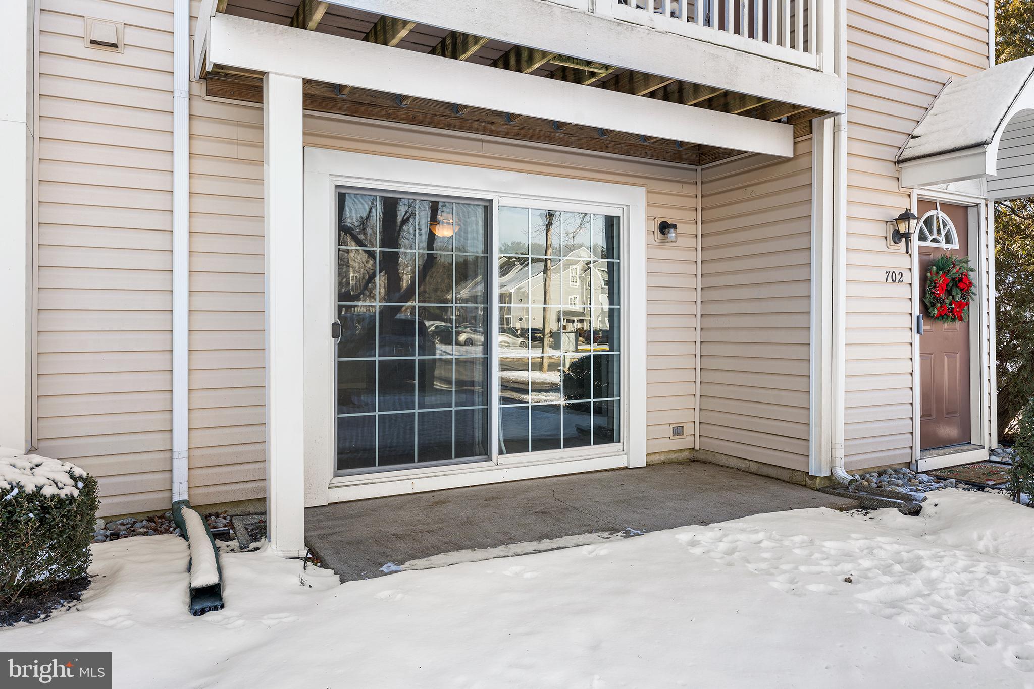701 Sedgewick Court, Unit 701 Sewell, NJ 08080 - Photo 25 of 31 a front view of a house with a yard and garage