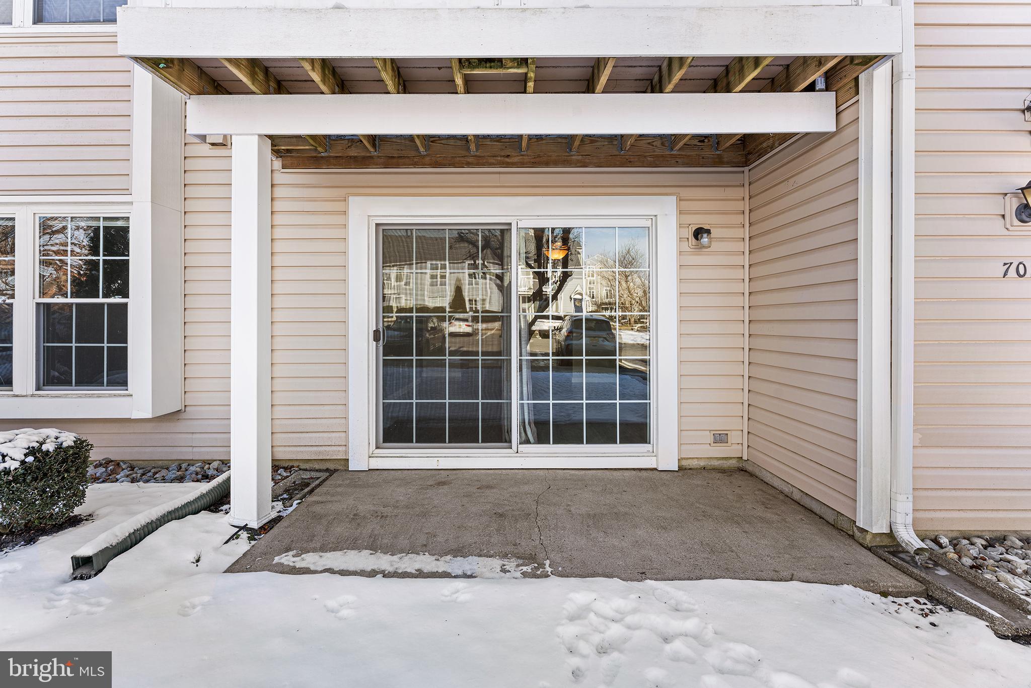 701 Sedgewick Court, Unit 701 Sewell, NJ 08080 - Photo 27 of 31 a front view of a house with a yard and garage