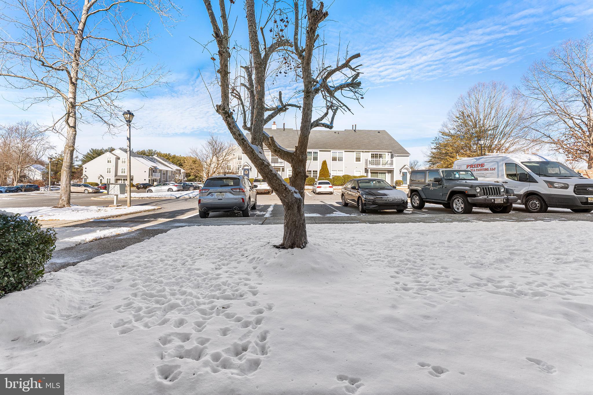 701 Sedgewick Court, Unit 701 Sewell, NJ 08080 - Photo 28 of 31 a street view with couple of cars parked on road