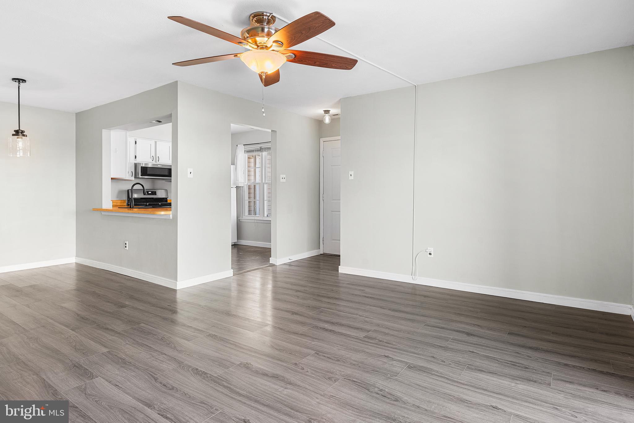 701 Sedgewick Court, Unit 701 Sewell, NJ 08080 - Photo 8 of 31 a view of a kitchen with wooden floor and a ceiling fan
