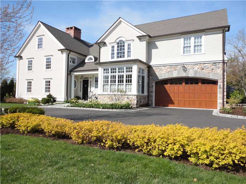 2 Bishops Gate Road Darien, CT 06820 - Photo 1 of 25 a front view of a house with a garden