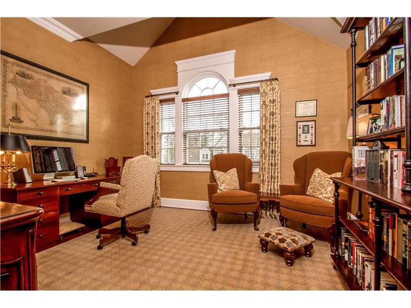 2 Bishops Gate Road Darien, CT 06820 - Photo 13 of 25 a living room with furniture a bookshelf and a window