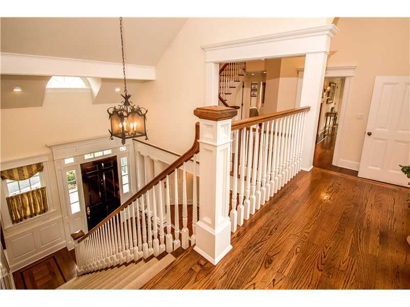 2 Bishops Gate Road Darien, CT 06820 - Photo 14 of 25 a view of staircase with railing and a chandelier