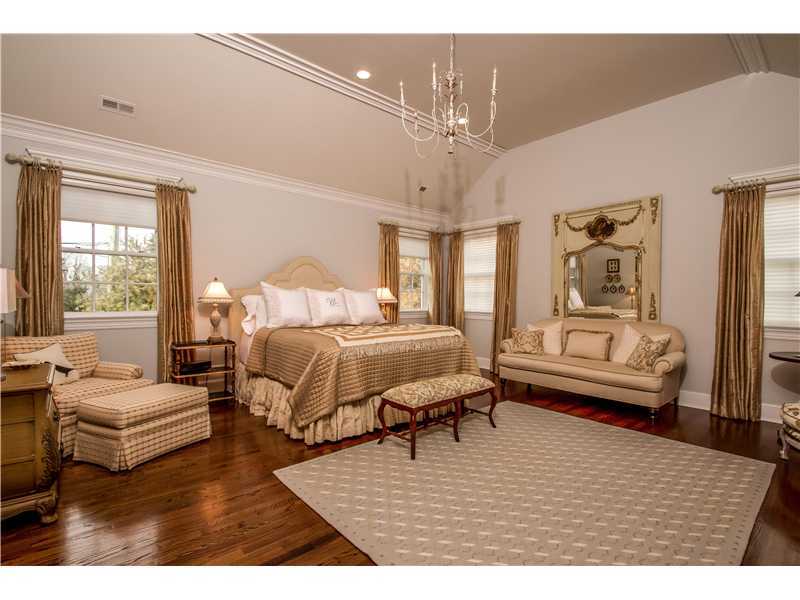 2 Bishops Gate Road Darien, CT 06820 - Photo 16 of 25 a living room with furniture and a chandelier