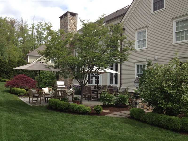 2 Bishops Gate Road Darien, CT 06820 - Photo 21 of 25 a front view of a house with garden