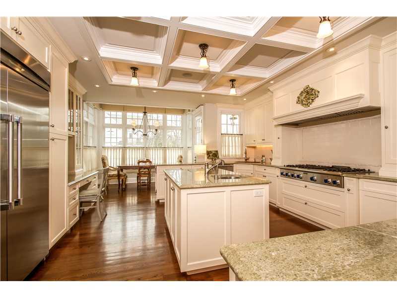 2 Bishops Gate Road Darien, CT 06820 - Photo 8 of 25 a kitchen with a stove a refrigerator and a dining table