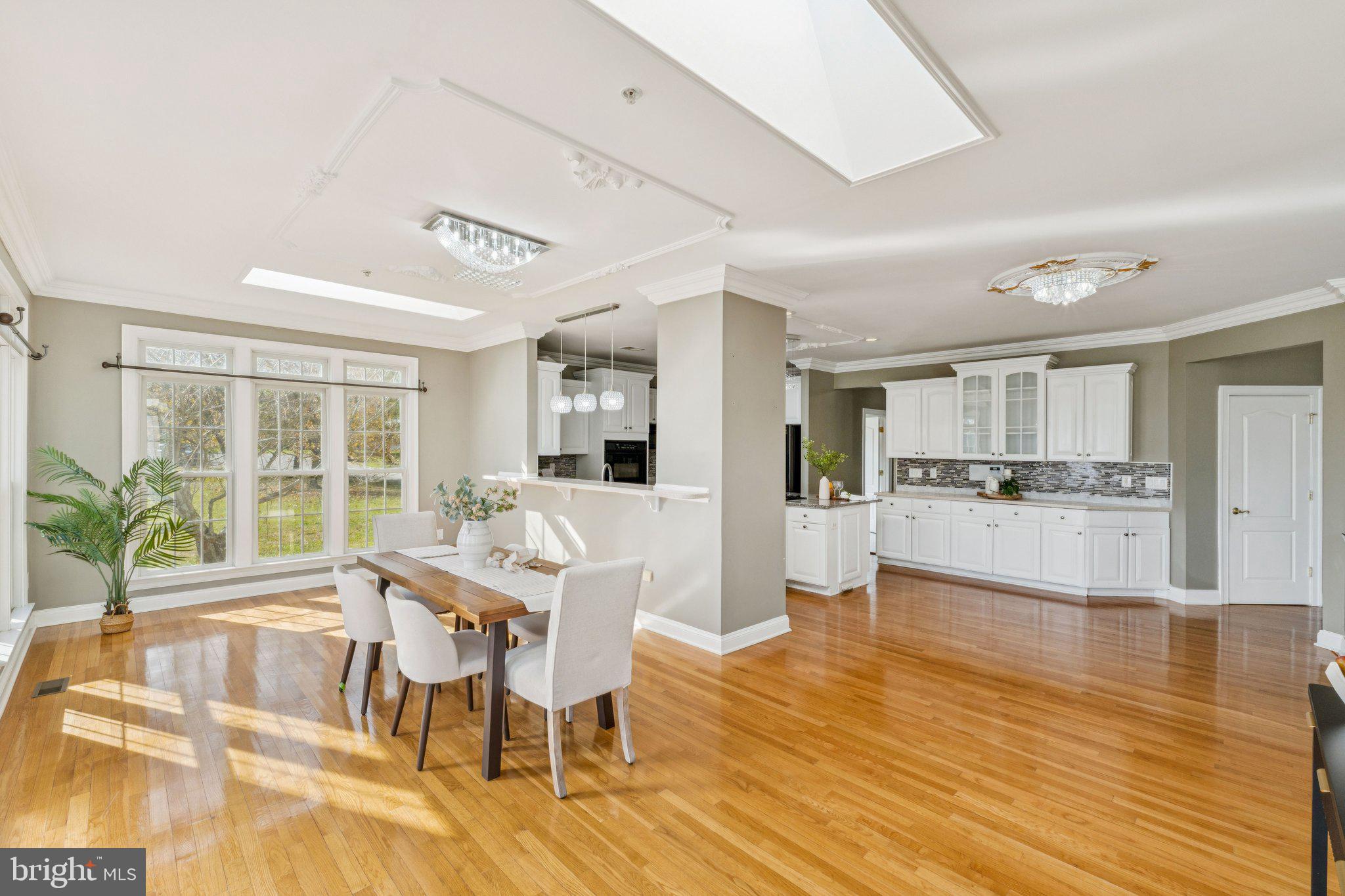 2205 Dhow Court Bowie, MD 20721 - Photo 13 of 40 a view of a dining room with furniture and wooden floor