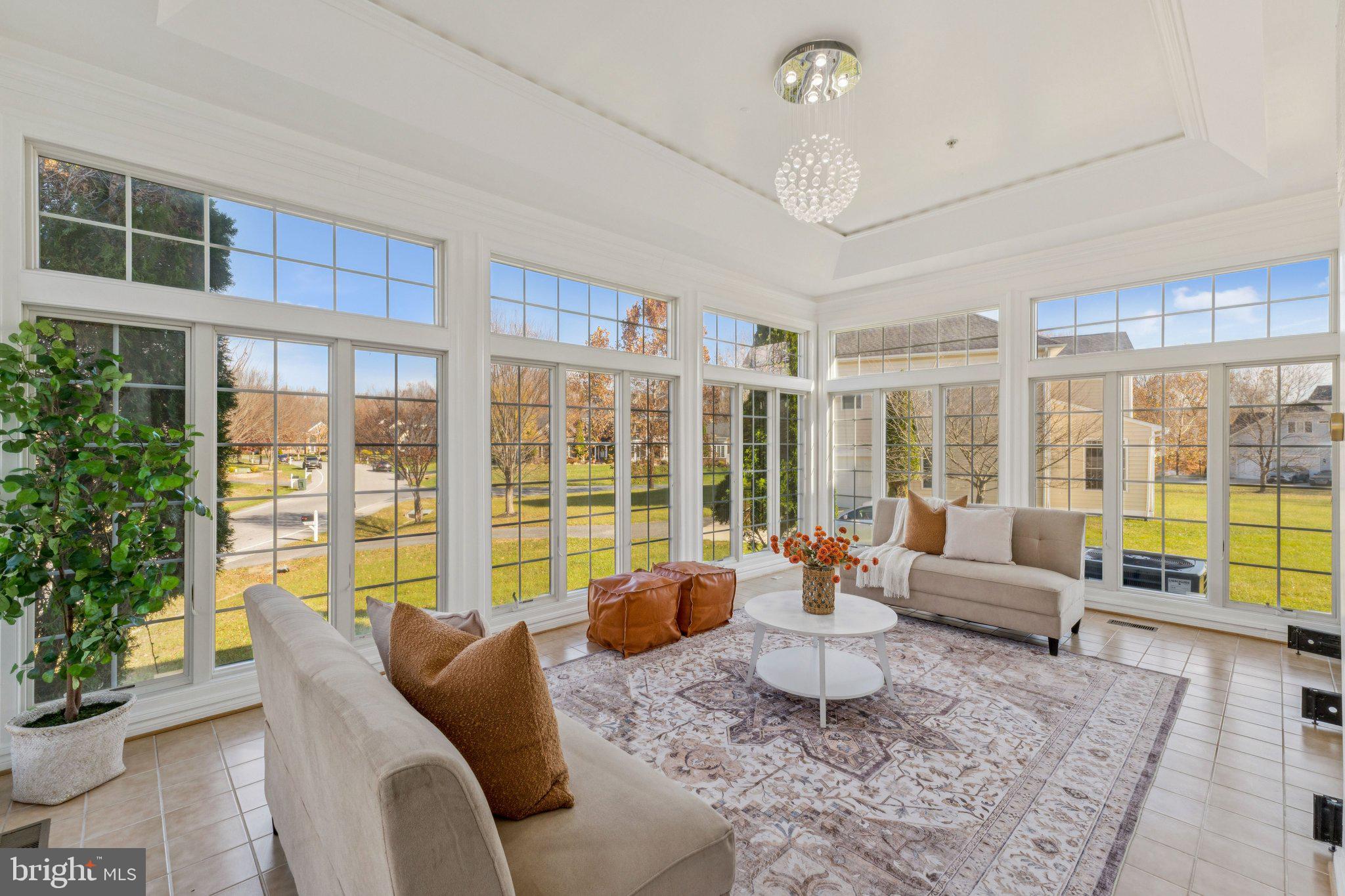2205 Dhow Court Bowie, MD 20721 - Photo 15 of 40 a living room with furniture and floor to ceiling windows