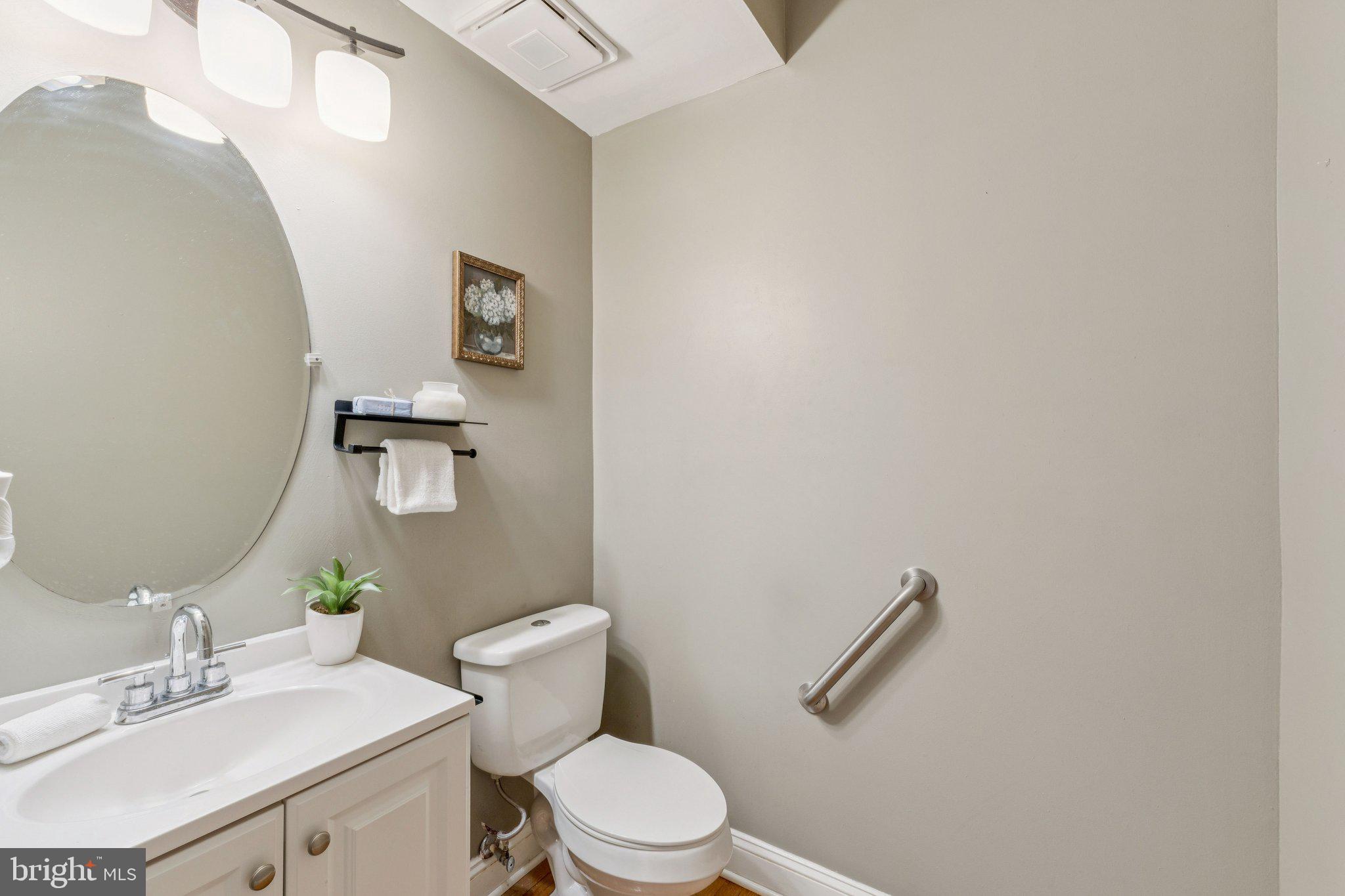 2205 Dhow Court Bowie, MD 20721 - Photo 17 of 40 a white toilet sitting next to a bathroom sink