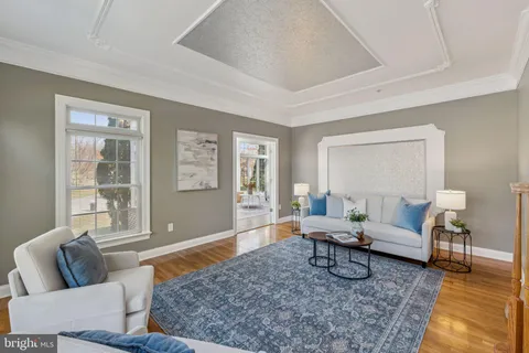 a living room with furniture and a rug