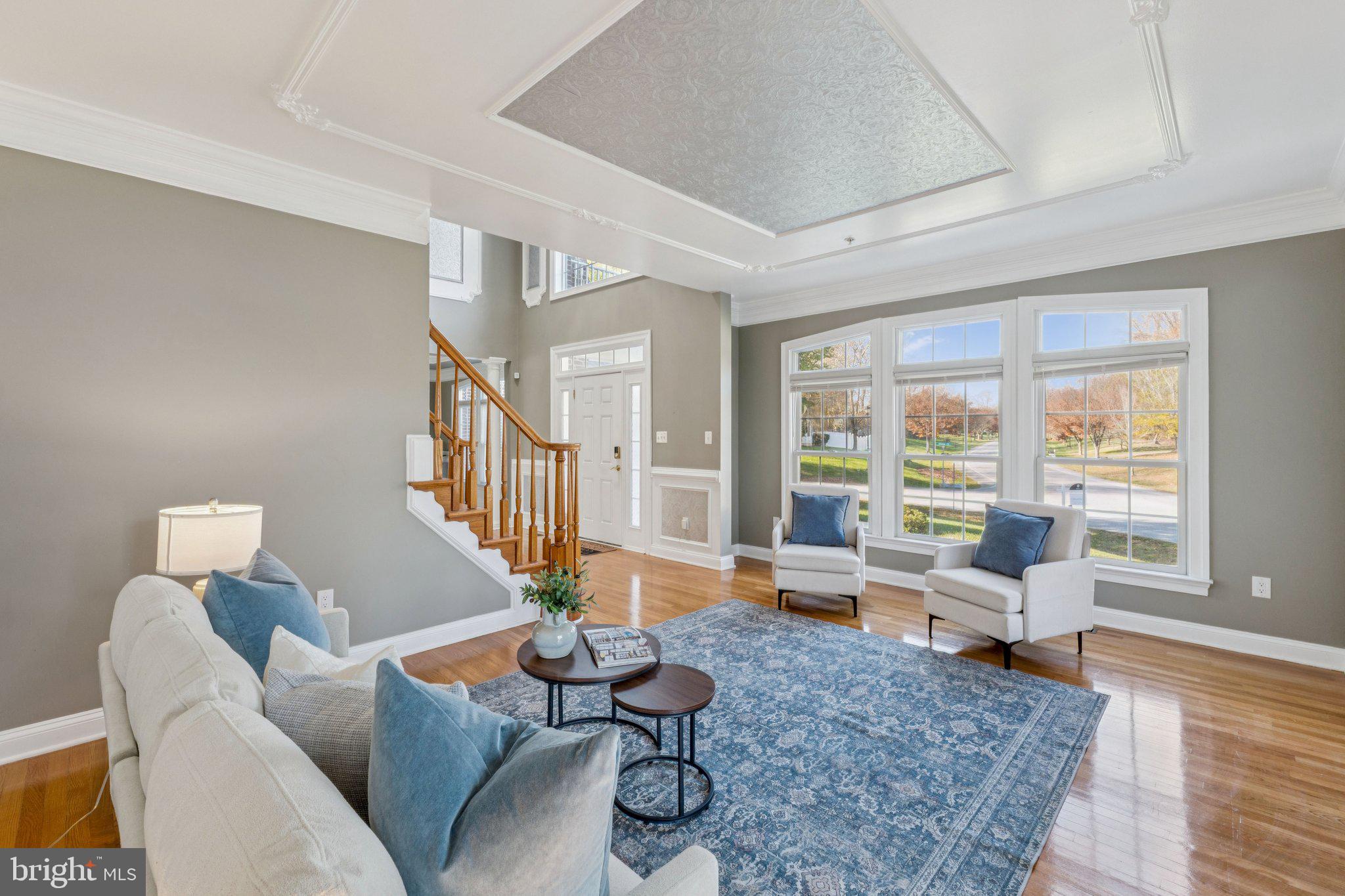 2205 Dhow Court Bowie, MD 20721 - Photo 19 of 40 a living room with furniture and floor to ceiling windows