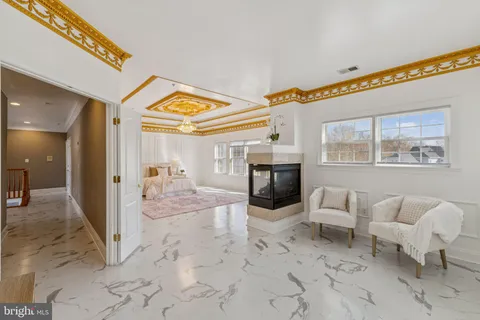 a view of a livingroom with furniture and windows