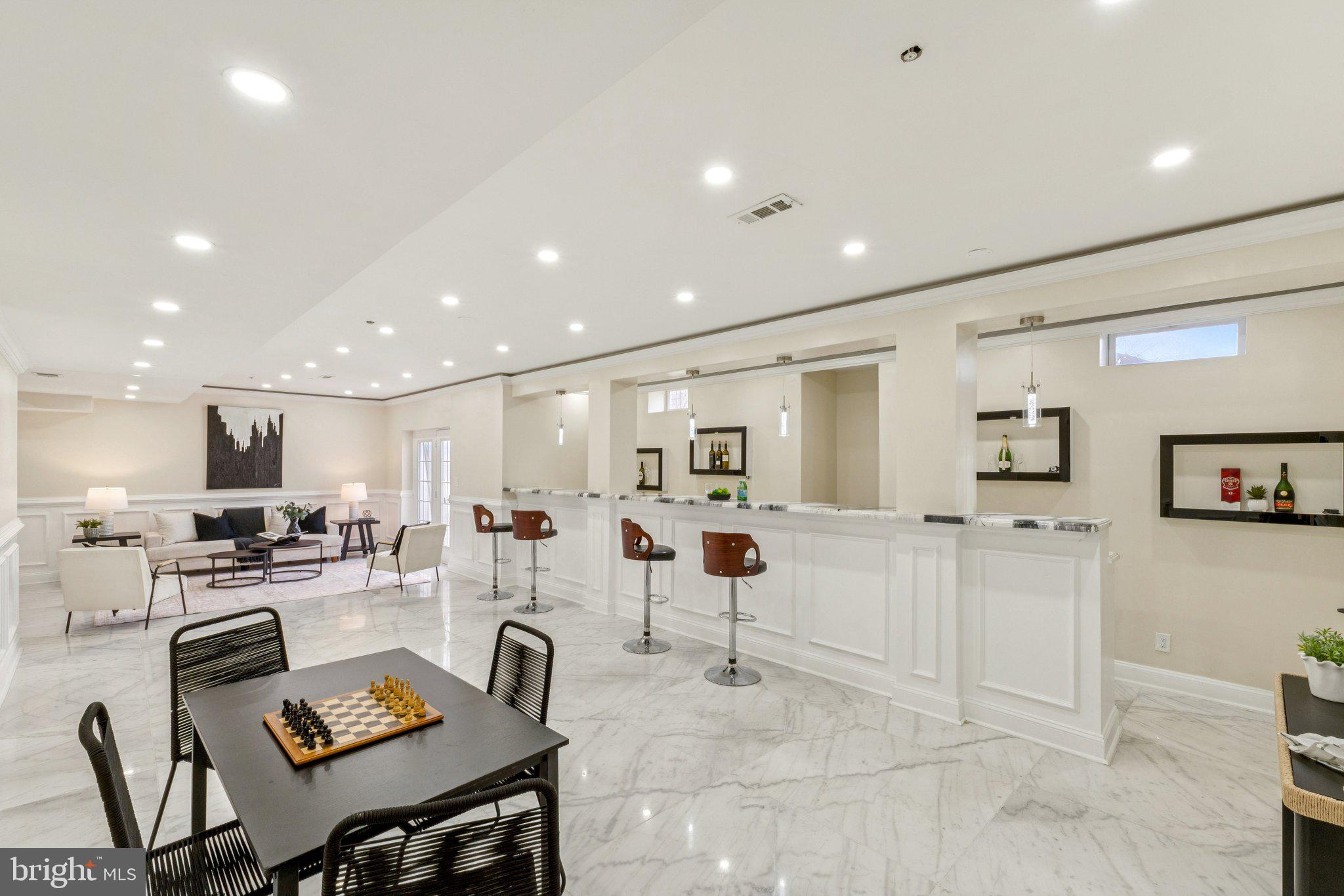 2205 Dhow Court Bowie, MD 20721 - Photo 33 of 40 a kitchen with a sink and chairs