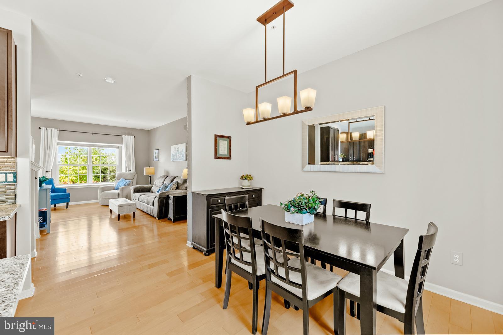 3669 Jacob Stout Road, Unit 8 Doylestown, PA 18902 - Photo 11 of 38 a view of a dining room with furniture window and wooden floor