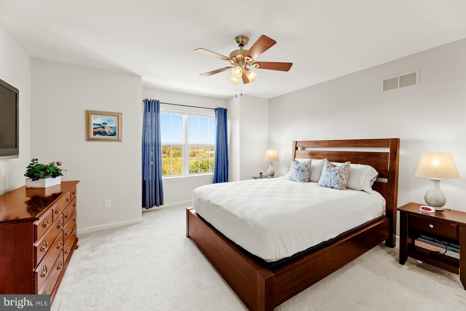 3669 Jacob Stout Road, Unit 8 Doylestown, PA 18902 - Photo 14 of 38 a bedroom with a bed and window