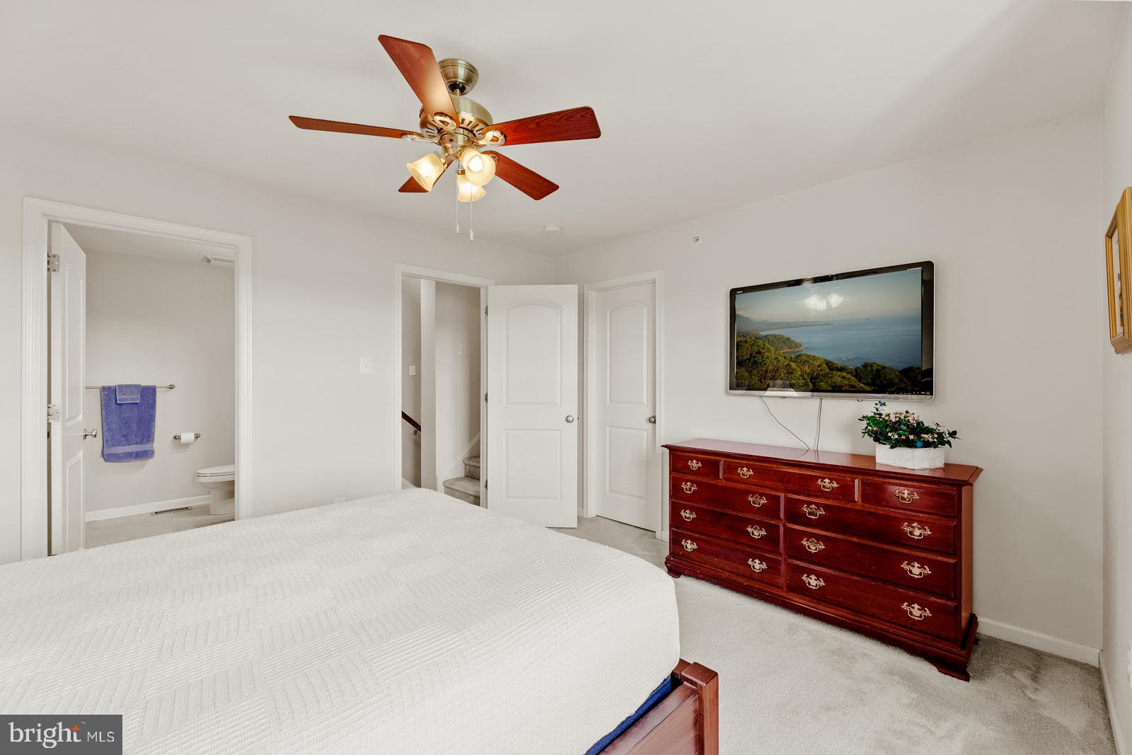 3669 Jacob Stout Road, Unit 8 Doylestown, PA 18902 - Photo 16 of 38 a bedroom with a bed and a flat screen tv