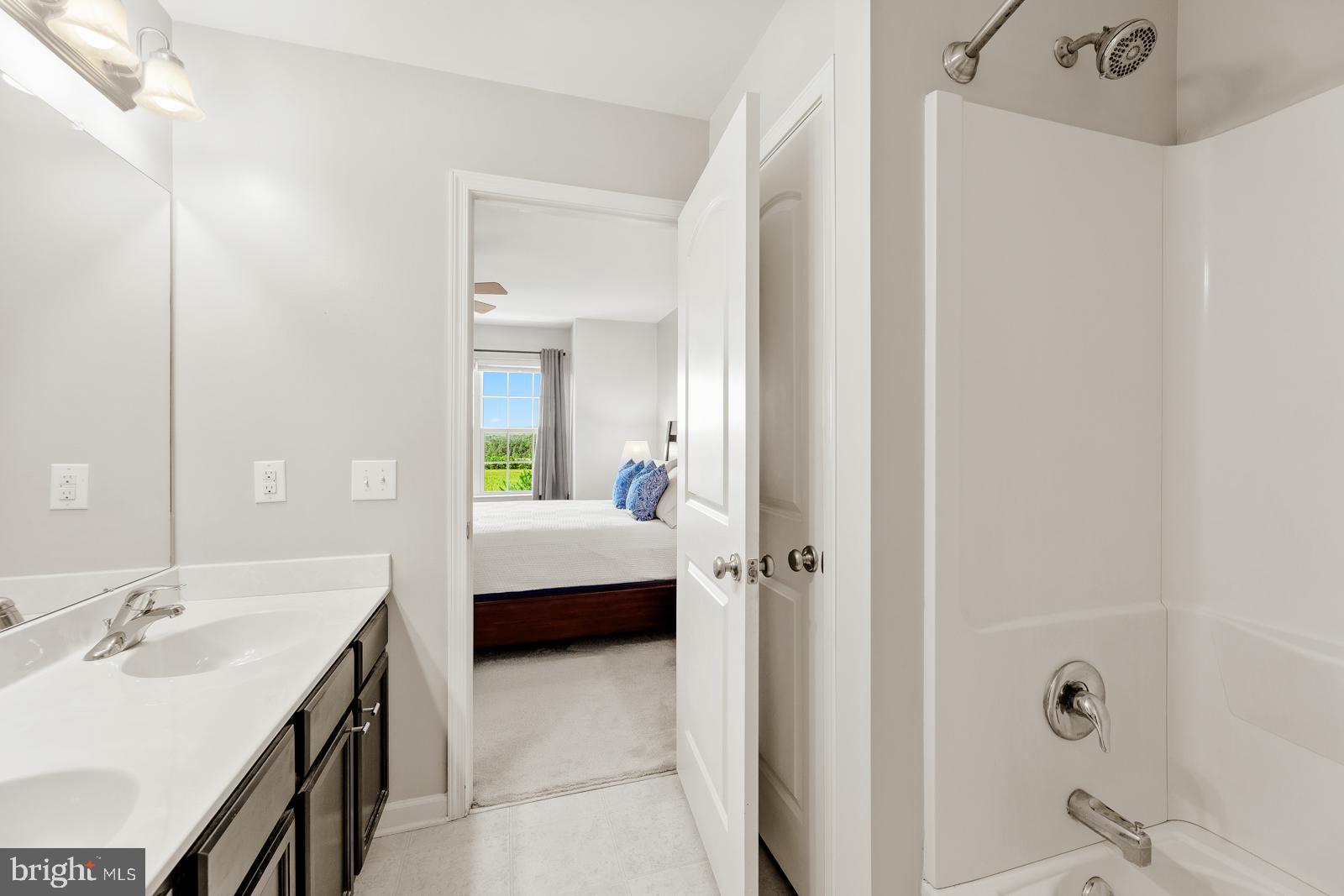 3669 Jacob Stout Road, Unit 8 Doylestown, PA 18902 - Photo 19 of 38 a en suite bathroom with a double vanity sink a mirror and shower