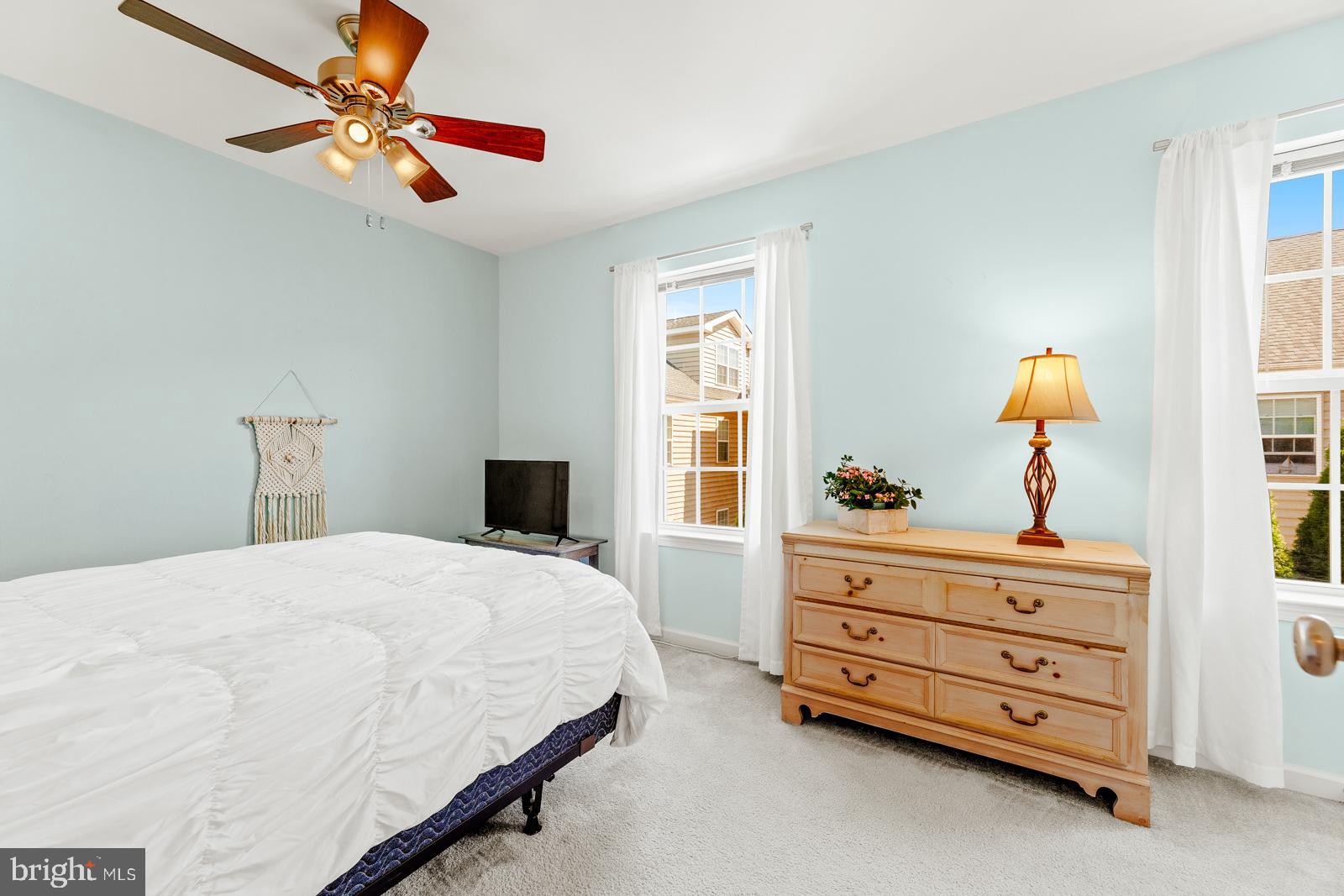 3669 Jacob Stout Road, Unit 8 Doylestown, PA 18902 - Photo 21 of 38 a bedroom with a bed dresser and a window