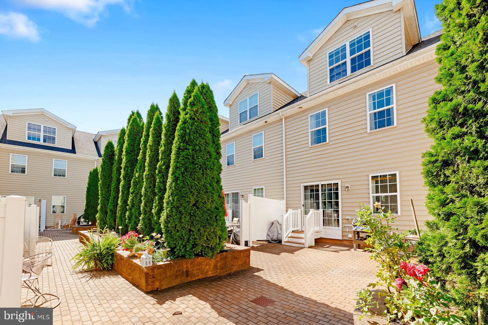 3669 Jacob Stout Road, Unit 8 Doylestown, PA 18902 - Photo 34 of 38 a view of a backyard with sitting area