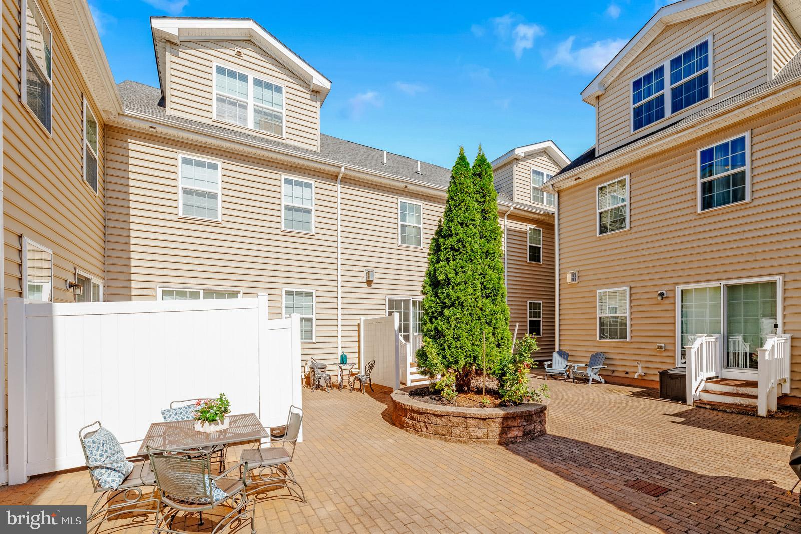 3669 Jacob Stout Road, Unit 8 Doylestown, PA 18902 - Photo 35 of 38 a view of a patio with couches table and chairs and potted plants