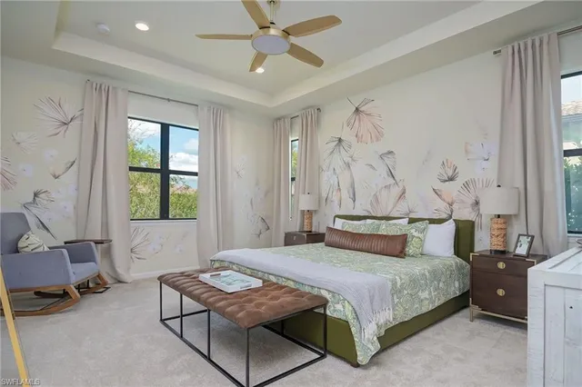 a bedroom with a bed a table and chair