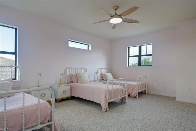 a room with a bed and a chandelier