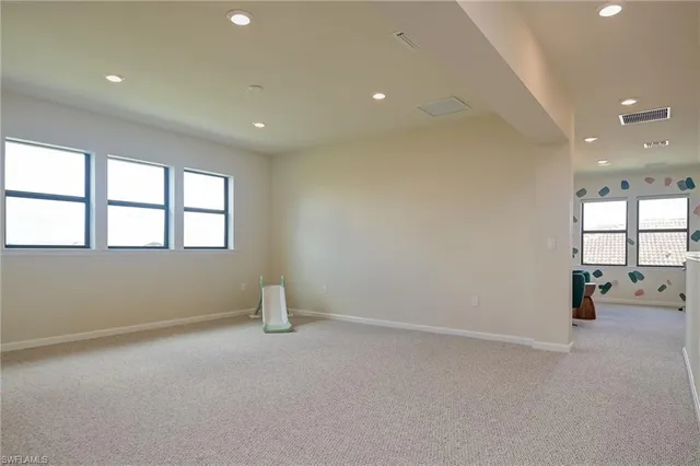 an empty room with windows