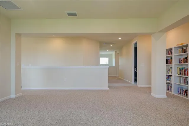 a view of an empty room with shelves