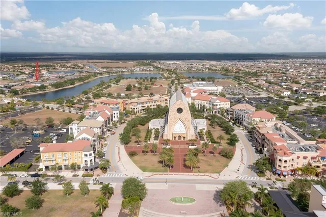 an aerial view of residential building and ocean