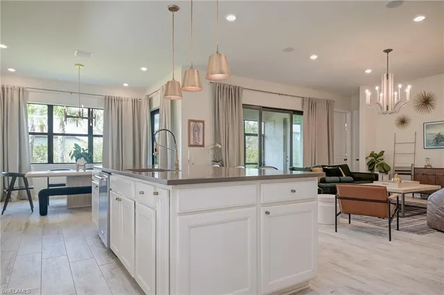 a living room with granite countertop furniture and a large window