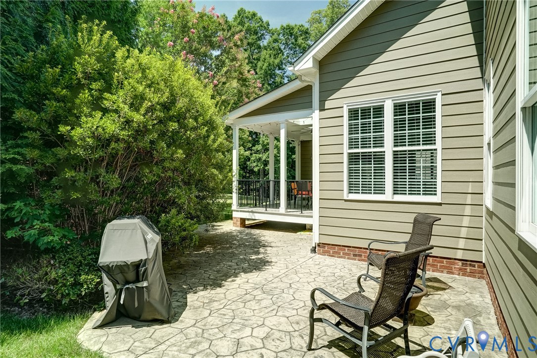 3606 Edenfield Road Midlothian, VA 23113 - Photo 67 of 67 Stenciled concrete patio with a covered porch, hor
