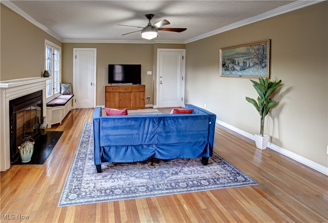 17800 Winslow Road Beachwood, OH 44122 - Photo 23 of 31 Living room featuring ceiling fan, light hardwood / wood-style floors, and crown molding
