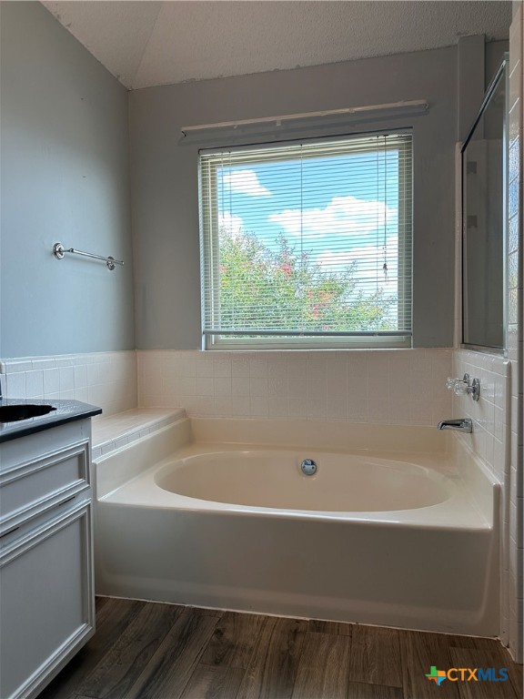 902 Tank Street Copperas Cove, TX 76522 - Photo 15 of 27 a white bath tub sitting in a bathroom next to a window