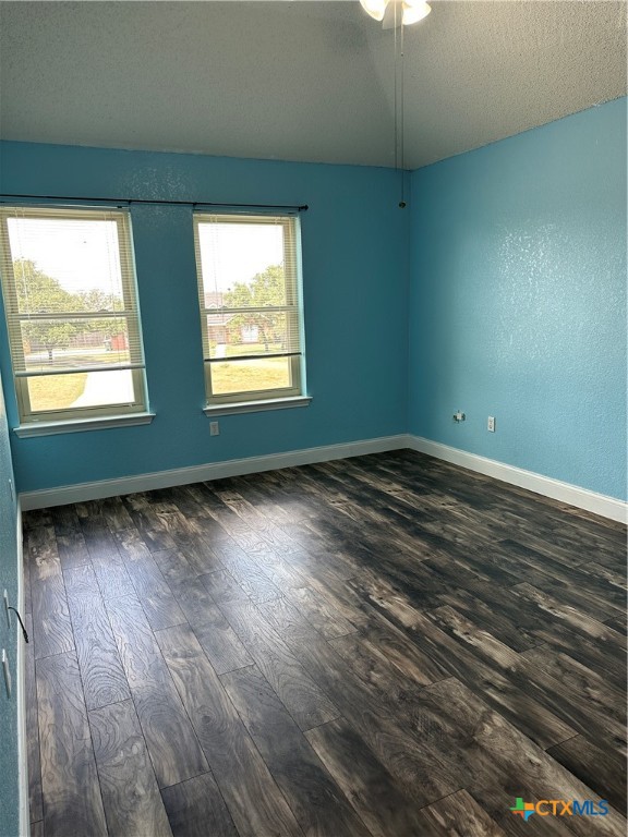 902 Tank Street Copperas Cove, TX 76522 - Photo 19 of 27 an empty room with wooden floor and windows