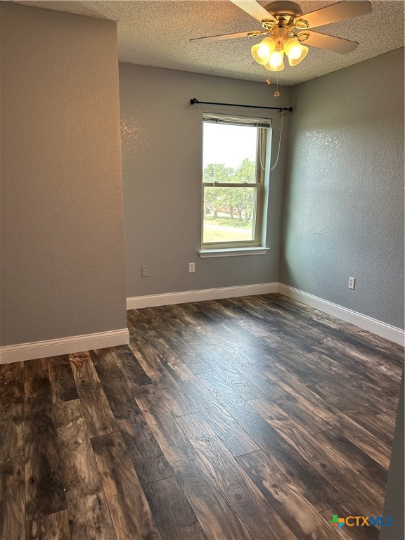 902 Tank Street Copperas Cove, TX 76522 - Photo 21 of 27 an empty room with wooden floor and windows