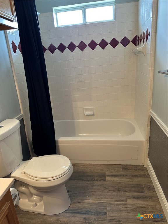 902 Tank Street Copperas Cove, TX 76522 - Photo 22 of 27 a white toilet sitting next to a bath tub