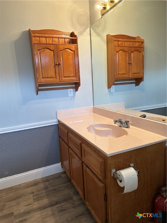 902 Tank Street Copperas Cove, TX 76522 - Photo 23 of 27 a bathroom with a sink and a mirror
