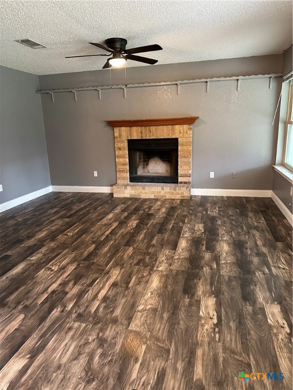 902 Tank Street Copperas Cove, TX 76522 - Photo 3 of 27 a view of empty room with wooden floor and fireplace