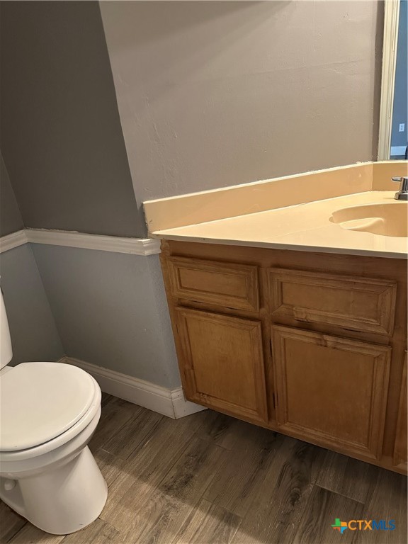 902 Tank Street Copperas Cove, TX 76522 - Photo 9 of 27 a bathroom with a toilet and a sink