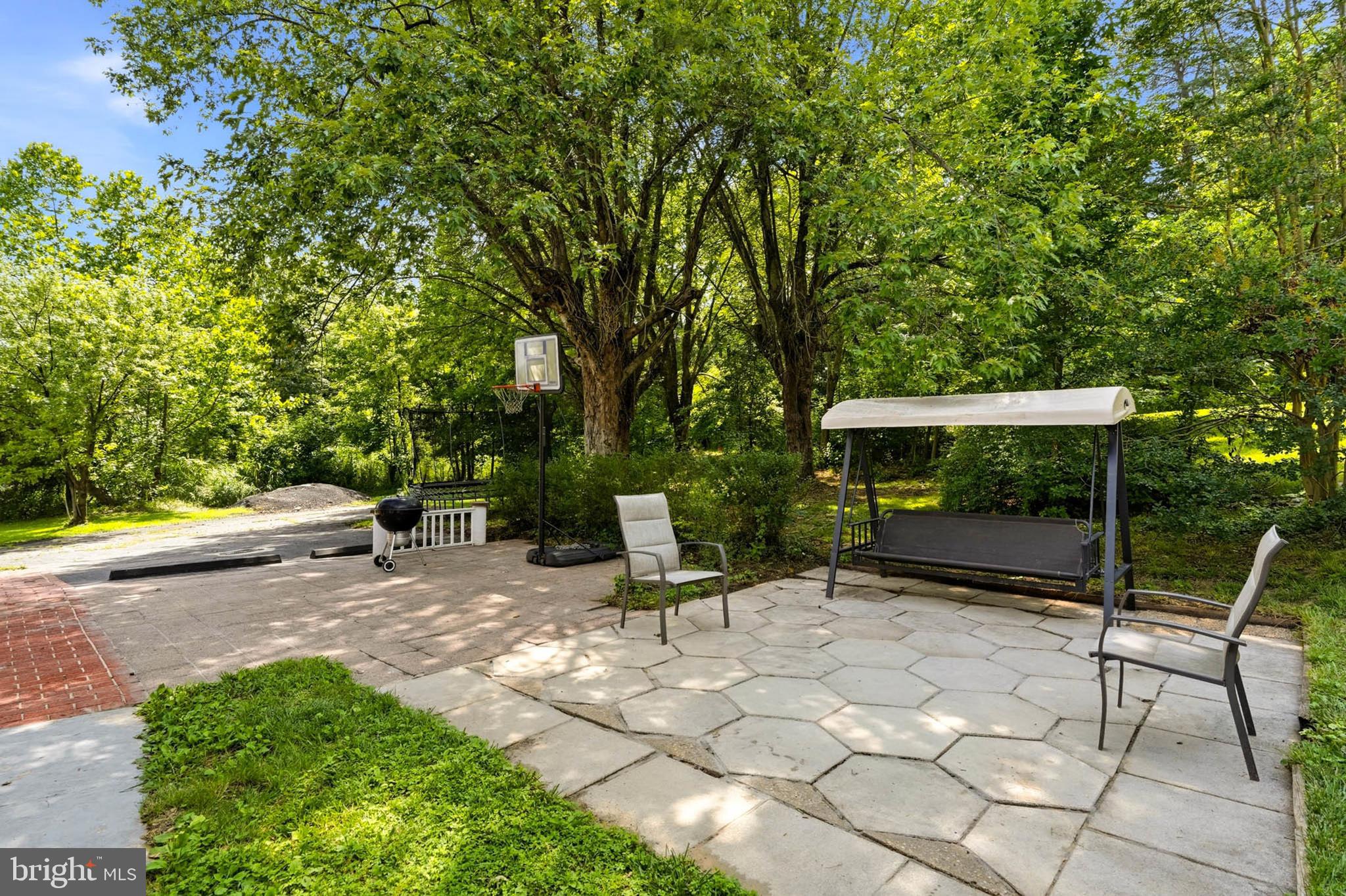 7948 Max Blobs Park Road Hanover, MD 21076 - Photo 33 of 42 Patio with Mature Shade Trees